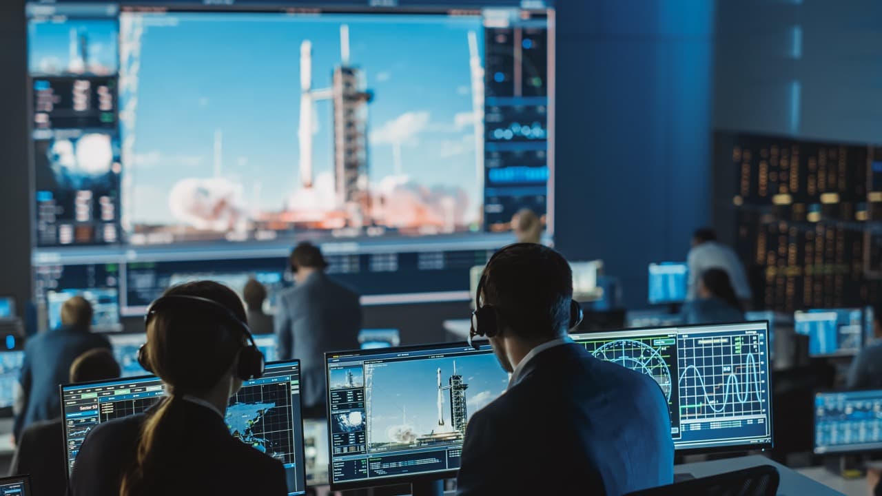 Mission operations team working at control consoles